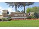 Entrance sign to Cedar Grove at The Woodlands, a deed-restricted community with manicured landscaping at 2522 Charter Oak Dr, North Port, FL 34289