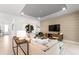 Stylish living room features modern decor, neutral tones, wood-accented wall, and ample seating space at 2522 Charter Oak Dr, North Port, FL 34289