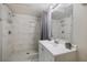 Bathroom with marble tile in the shower, and a sink with a vanity cabinet at 2607 N 59Th St, Tampa, FL 33619