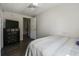 Bedroom featuring wood-look flooring, a dresser, and a comfortable bed at 2607 N 59Th St, Tampa, FL 33619