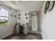 Bright entryway with a desk area, stylish decor, and a decorative door for a welcoming first impression at 2607 N 59Th St, Tampa, FL 33619