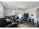 Comfortable living room with a large sectional sofa, modern TV, and sleek furnishings for relaxed living at 2607 N 59Th St, Tampa, FL 33619