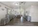 Spacious main bedroom with wood-look flooring, mirrored dressers, and ample natural light at 2607 N 59Th St, Tampa, FL 33619