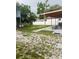 Spacious backyard with a patio, large shed, and white vinyl fencing at 2610 W Powhatan Ave, Tampa, FL 33614