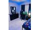 Contemporary bedroom with gaming setup, modern furniture, and sleek decor at 2610 W Powhatan Ave, Tampa, FL 33614