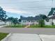 Charming single-story home featuring a white picket fence and well-maintained landscaping at 2610 W Powhatan Ave, Tampa, FL 33614