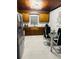 Eat-in kitchen with stainless steel appliances, granite countertops, and wood cabinets at 2610 W Powhatan Ave, Tampa, FL 33614