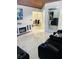 Stylish living room with modern furniture, a large mirror, and elegant decor at 2610 W Powhatan Ave, Tampa, FL 33614