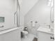 Modern bathroom with glass-enclosed shower, sleek vanity, and white tile at 2809 N 21St St, Tampa, FL 33605
