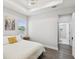 Serene bedroom features a tray ceiling, a painting, and an ensuite bathroom at 2809 N 21St St, Tampa, FL 33605