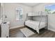 Cozy bedroom with a bunk bed, hardwood floors, and ample natural light at 2809 N 21St St, Tampa, FL 33605