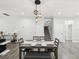 Dining area featuring modern light fixtures and adjacent staircase at 2809 N 21St St, Tampa, FL 33605