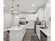 Bright kitchen featuring white cabinetry, stainless steel appliances, and a large island at 2809 N 21St St, Tampa, FL 33605