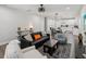 Open-concept living room with modern decor, hardwood floors, and abundant natural light at 2809 N 21St St, Tampa, FL 33605