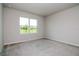 Carpeted bedroom with a large window letting in natural light at 3062 Victoria Inlet Dr, Holiday, FL 34691