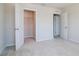 Bedroom view featuring a closet with an open door and white trim and carpeting at 3062 Victoria Inlet Dr, Holiday, FL 34691