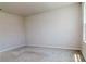 Bright bedroom featuring neutral walls and carpet, with natural light coming in from the window at 3062 Victoria Inlet Dr, Holiday, FL 34691