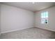 Bright bedroom with neutral carpet, a window letting in natural light, and freshly painted walls at 3062 Victoria Inlet Dr, Holiday, FL 34691