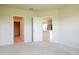 Open bedroom view with access to the kitchen and walk-in closet at 3062 Victoria Inlet Dr, Holiday, FL 34691