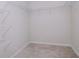 Walk-in closet with multiple shelves for organization at 3062 Victoria Inlet Dr, Holiday, FL 34691