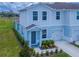 Charming two-story townhome featuring a well-manicured lawn and attached garage, and inviting entrance at 3062 Victoria Inlet Dr, Holiday, FL 34691