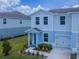 Charming two-story home with a well-manicured lawn and inviting entryway at 3062 Victoria Inlet Dr, Holiday, FL 34691