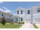 Charming two-story townhome with a well-manicured lawn and a one-car garage at 3062 Victoria Inlet Dr, Holiday, FL 34691