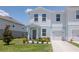 Charming two-story townhome featuring a one car garage and manicured landscaping at 3062 Victoria Inlet Dr, Holiday, FL 34691