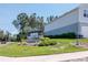 Anclote community sign surrounded by lush landscaping, creating a welcoming entrance at 3062 Victoria Inlet Dr, Holiday, FL 34691