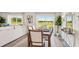 Elegant dining area with a modern table, scenic views, and an open layout for gatherings at 3071 Pink Gerbera Sq, Plant City, FL 33566