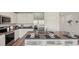 Stylish kitchen island featuring stainless steel appliances, modern finishes, and eat-in bar at 3071 Pink Gerbera Sq, Plant City, FL 33566