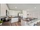 Modern kitchen with stainless steel appliances and center island seating at 3071 Pink Gerbera Sq, Plant City, FL 33566