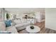 Inviting living area flows into a modern kitchen, perfect for entertaining and everyday living at 3071 Pink Gerbera Sq, Plant City, FL 33566