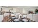Open-concept living space featuring a modern kitchen, dining area, and comfortable living room at 3071 Pink Gerbera Sq, Plant City, FL 33566