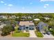 An aerial view of the waterfront home and surrounding neighborhood showing water access and lush landscaping at 316 Hillpoint Dr, Palm Harbor, FL 34683