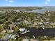 Expansive aerial view of a waterfront community showcasing canal access and lush landscapes at 316 Hillpoint Dr, Palm Harbor, FL 34683