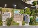Aerial view highlighting the backyard with a pool, patio, and canal frontage with dock at 316 Hillpoint Dr, Palm Harbor, FL 34683