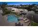 Aerial view of a pool, spa, patio area, boat dock and lift on a sunny day at 316 Hillpoint Dr, Palm Harbor, FL 34683