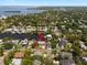 Aerial view of the neighborhood showcasing a home with canal access and a private boat dock at 316 Hillpoint Dr, Palm Harbor, FL 34683