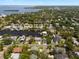 Aerial view shows property nestled within a waterfront community with canal access at 316 Hillpoint Dr, Palm Harbor, FL 34683