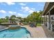 Backyard features a pool, spa, and patio area, perfect for outdoor entertaining near the water at 316 Hillpoint Dr, Palm Harbor, FL 34683