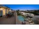 Outdoor deck with dining area overlooking the pool and waterfront at 316 Hillpoint Dr, Palm Harbor, FL 34683