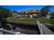 Rear exterior view of a multi-story home with a waterfront backyard and dock at 316 Hillpoint Dr, Palm Harbor, FL 34683