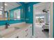 Bathroom featuring a sink vanity with a view to the bedroom and outdoor balcony at 316 Hillpoint Dr, Palm Harbor, FL 34683