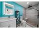 Beautifully renovated bathroom with a modern vanity and a luxurious tiled shower at 316 Hillpoint Dr, Palm Harbor, FL 34683