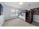Cozy bedroom featuring a wooden bunk bed with stairs and carpeted floors at 316 Hillpoint Dr, Palm Harbor, FL 34683