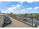 Waterfront deck with seating and views of the canal at 316 Hillpoint Dr, Palm Harbor, FL 34683