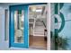 Open foyer with stained glass front door, wood floors, and staircase leading to the second level at 316 Hillpoint Dr, Palm Harbor, FL 34683