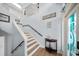 Bright foyer with wood floors, staircase, decor, and high ceilings at 316 Hillpoint Dr, Palm Harbor, FL 34683