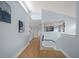 Bright hallway with hardwood floors and transom windows at 316 Hillpoint Dr, Palm Harbor, FL 34683